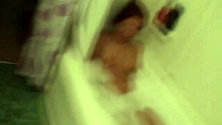 Misty undresses and bathes in the bathtub with natural brunette features