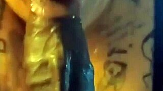 A plump BBW eagerly sucks a massive black cock in the bedroom.