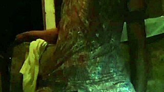 Young gay man in lingerie enjoys solo play with a dildo in a casual setting.