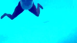 Mysterious ebony in see-through bikini underwater