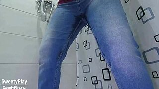 A woman in desperate need wets her jeans
