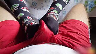 Footjob with socks and cum in his shorts