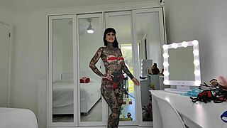 melody radford tries on red and blue micro bikini