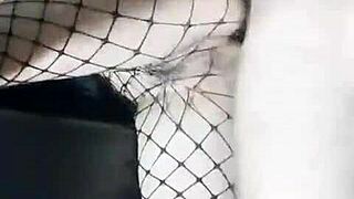 Slender girlfriend in skirt and stockings stands with friend at home