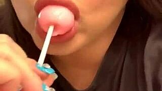 Marcy Diamond is enjoying a lollipop with lots of spit in a fun, messy way