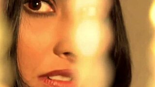 A sexy little Indian woman teases with her hands and mouth in an amateur video.