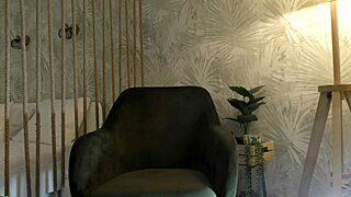 Redhead tease sits on chair flashing her hairy pussy backstage!