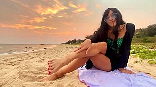 A beautiful girl with long hair chases sunsets on the beach, feeling pure joy.