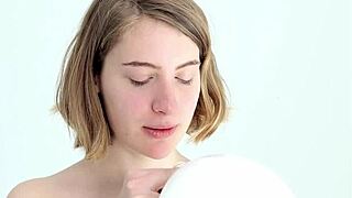 Hey there, watch this young looner babe blow and pop her first balloon!