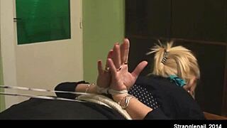 This girl is hogtied with palms out in bondage.