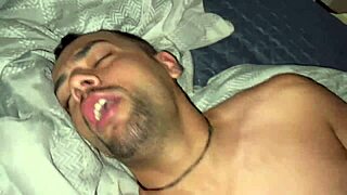 Two chubby black guys engage in hot gay sex on the bed