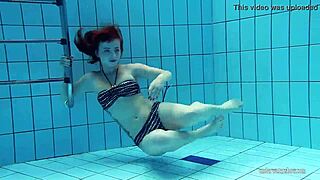 I’m Mesmerized Watching Redheaded Katrin Strip Underwater in the Pool
