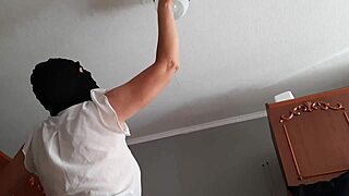 while my housekeeper washed the chandelier i watched her and masturbated