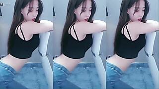 sexy chinese girl dances with vibrator making her pussy horny