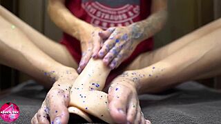 Why does this babe stroke my rubber cock with her feet?