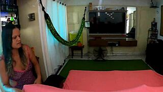 White-haired person watches boat owner's house from afar at party.