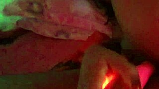 Mature african woman fingers her pussy and plays with anal toys.