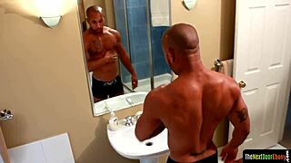 Tattooed Ebony Bodybuilder Strokes His Massive Cock