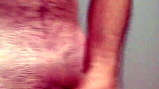The hard cock throbs during masturbation, leading to a powerful cum and orgasm