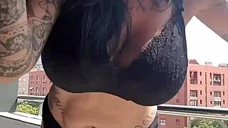 the neighbors are watching me masturbate with my big tits out