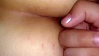 Married couple engages in anal sex at home.