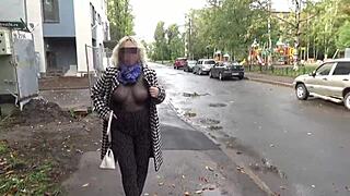 I love seeing this sexy milf in nylon with big boobs and ass walking outdoors in see through outfit