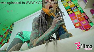 Skinny tattooed guy with dreadlocks fucking his ass with a huge toy