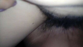 Wife spreads legs to show hairy pussy.