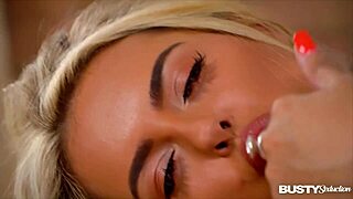 Katie T seductively licks her big tits in solo masturbation