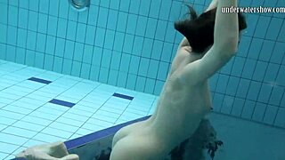 gazel podvodkova swims naked underwater in the pool