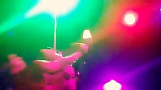 Beautiful music and dance moves of a stripper in knee highs and thong