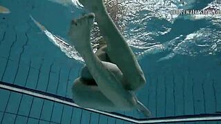 gazel podvodkova swims naked underwater in the pool
