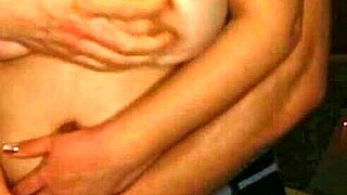 Seducing girlfriend with big breasts caressing in front of camera