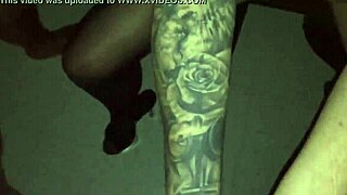 TATTOED CHICK SUCKS STRANGER IN VIDEO BOOTH