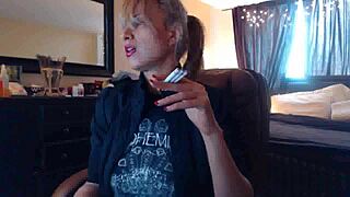 Sandi smokes cigarettes while her big tits squirt in fetish play