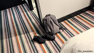 sharing a bed with a coworker led to unexpected gay action at the hotel.