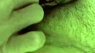 He helps her play with her pussy, fingering the clit in close-up.