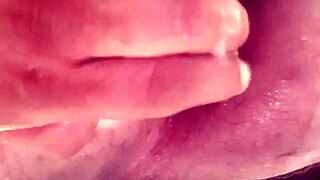 A gay stud enjoys close-up anal play with big dildos, leading to lactation