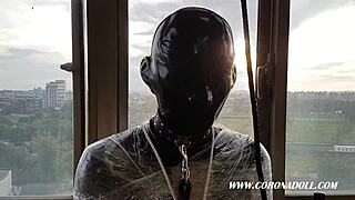 Rubber mask bondage play gets intense outdoors