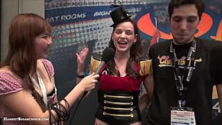 Fionna and Jimmy perform a Chaturbate video at the AE Expo with big tits