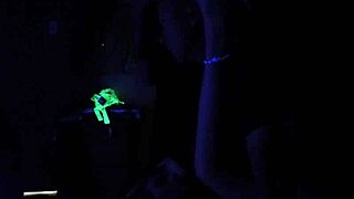 Carrie B Engages in Intense Blacklight Sex Scene, Sucking and Choking on Cock with Small Tits