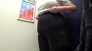 Look at this! Camera catches curvy milf's big ass in satin panties while changing in fitting room