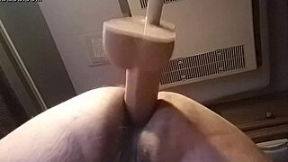 I'm bent over in doggystyle, sliding the huge dildo into my pussy