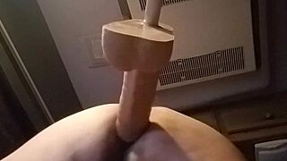 I'm bent over in doggystyle, sliding the huge dildo into my pussy