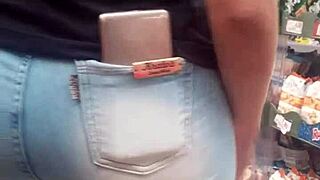 A Brunette Shows Off Her Hot Ass In The Market While Being Spied On.