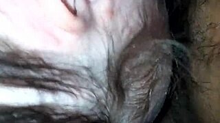 An interracial scene featuring moaning and deepthroat actions in a casual setting.