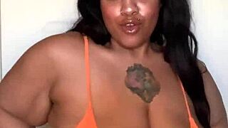 milf in bikini dances seductively on the beach