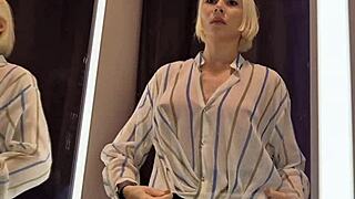 Trying on sexy see-through outfits in dressing room.