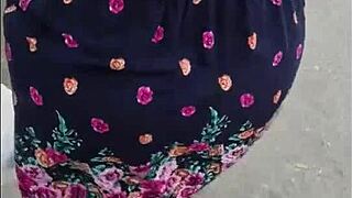 Caught this chubby teacher on the street, skirt and thong flashing big natural tits.