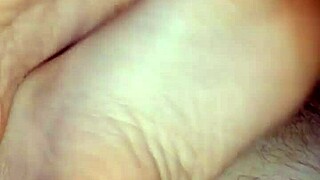 Watch this homemade bare footjob leading to big cumshot.
